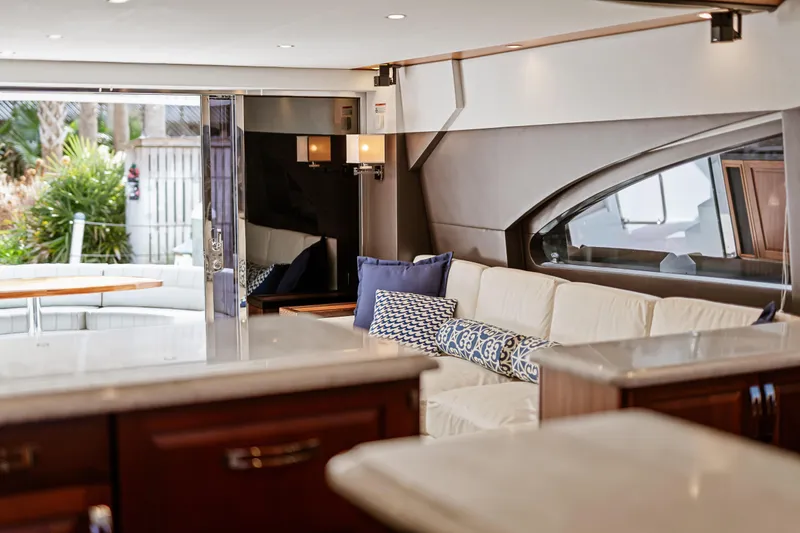 Elsewhere Yacht Photos Pics Luxurious interior of 2013 Hatteras 60 Motor Yacht with elegant seating and decor.