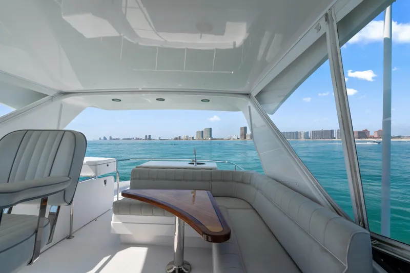 Elsewhere Yacht Photos Pics Luxurious 2013 Hatteras 60 Motor Yacht interior with ocean view and city skyline.