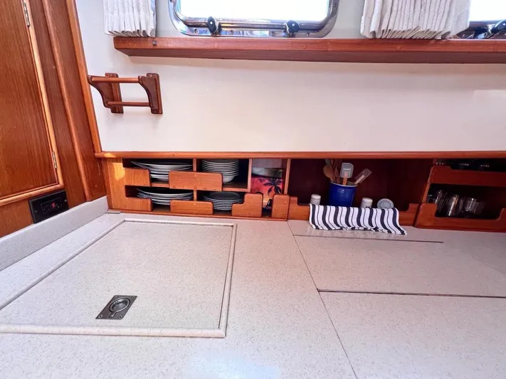  Yacht Photos Pics Galley interior of 1999 Grand Banks 42 Motoryacht with organized storage and countertop.