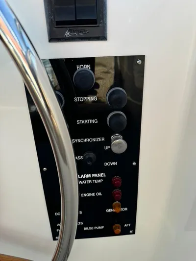  Yacht Photos Pics Control panel of a 1999 Grand Banks 42 Motoryacht with various switches and indicators.