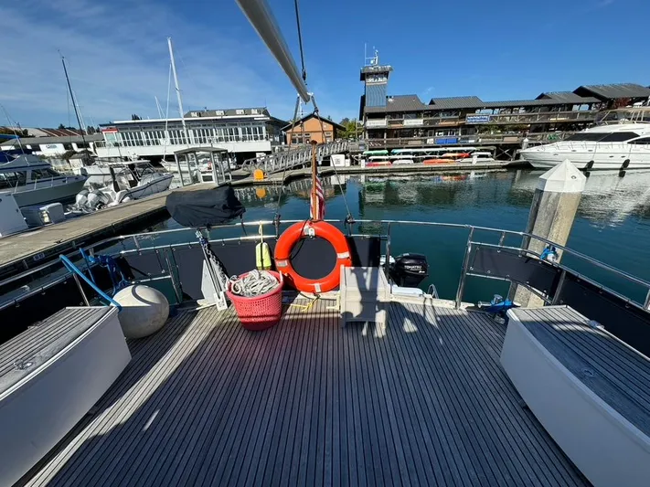  Yacht Photos Pics 1999 Grand Banks 42 Motoryacht docked at a marina with clear blue skies.