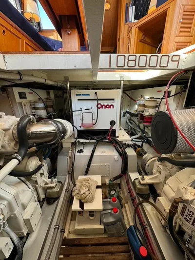  Yacht Photos Pics Engine room of a 1999 Grand Banks 42 Motoryacht with Onan generator and mechanical components.
