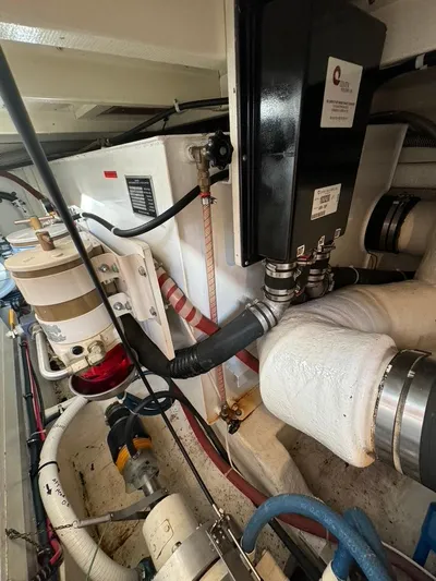  Yacht Photos Pics Engine room of 1999 Grand Banks 42 Motoryacht with various mechanical components.