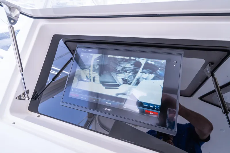  Yacht Photos Pics Display screen on 2005 Viking 56 yacht showing engine room camera feed.