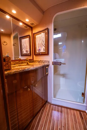  Yacht Photos Pics Luxurious bathroom in 2005 Viking 56 yacht with granite countertop and glass shower.