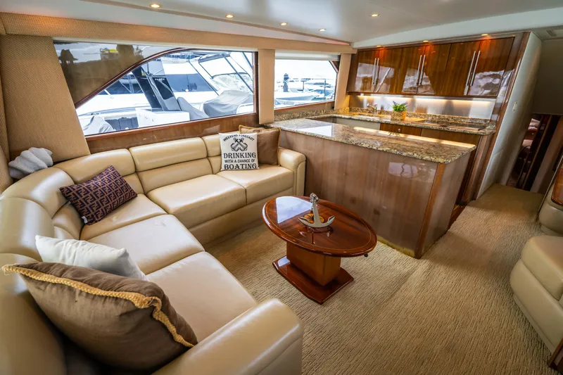  Yacht Photos Pics Luxurious interior of a 2005 Viking 56 yacht with elegant seating and modern kitchen.