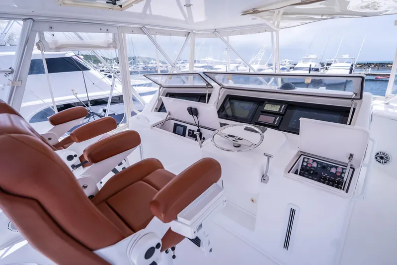  Yacht Photos Pics Luxurious 2005 Viking 56 yacht helm with leather seats and advanced navigation controls.