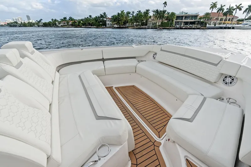 Gal Yam 3 Yacht Photos Pics Luxurious seating area on 2023 Tiara 48 LS yacht with waterfront view.