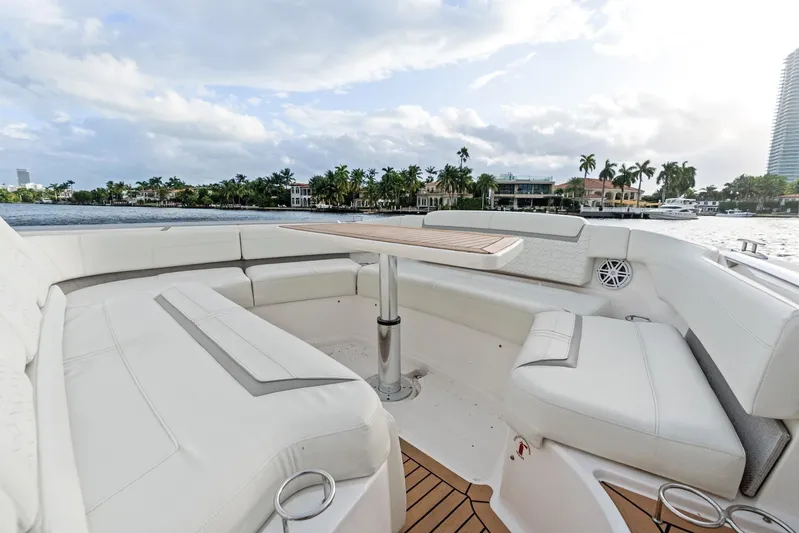 Gal Yam 3 Yacht Photos Pics Luxurious seating area on 2023 Tiara 48 LS yacht with waterfront view.
