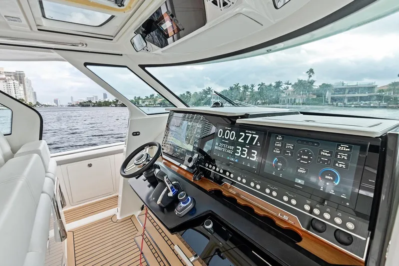 Gal Yam 3 Yacht Photos Pics 2023 Tiara 48 LS yacht cockpit with advanced navigation system and luxurious interior design.