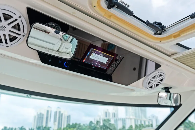 Gal Yam 3 Yacht Photos Pics Interior view of 2023 Tiara 48 LS boat with speakers and control panel.