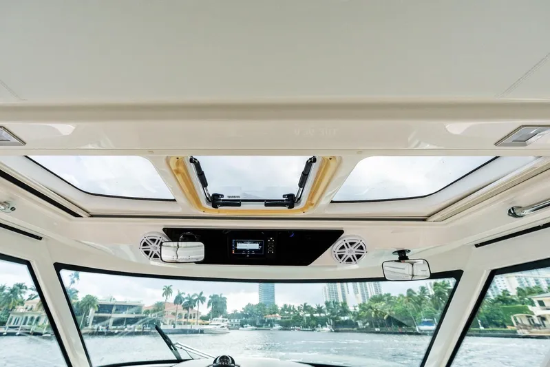 Gal Yam 3 Yacht Photos Pics Interior view of 2023 Tiara 48 LS yacht with sunroof and speakers.