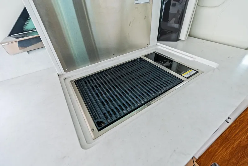 Gal Yam 3 Yacht Photos Pics Built-in grill on 2023 Tiara 48 LS yacht, featuring sleek countertop design.