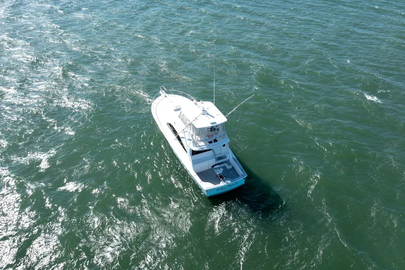 Sadie Ann II Yacht Photos Pics 2005 Ocean Yachts 50 Super Sport cruising on open water.