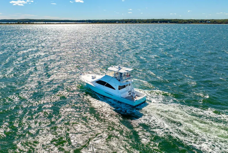 Sadie Ann II Yacht Photos Pics 2005 Ocean Yachts 50 Super Sport cruising on a sunny day.