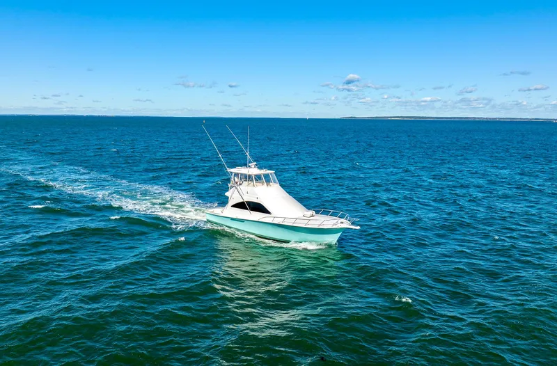 Sadie Ann II Yacht Photos Pics 2005 Ocean Yachts 50 Super Sport cruising on open blue sea.