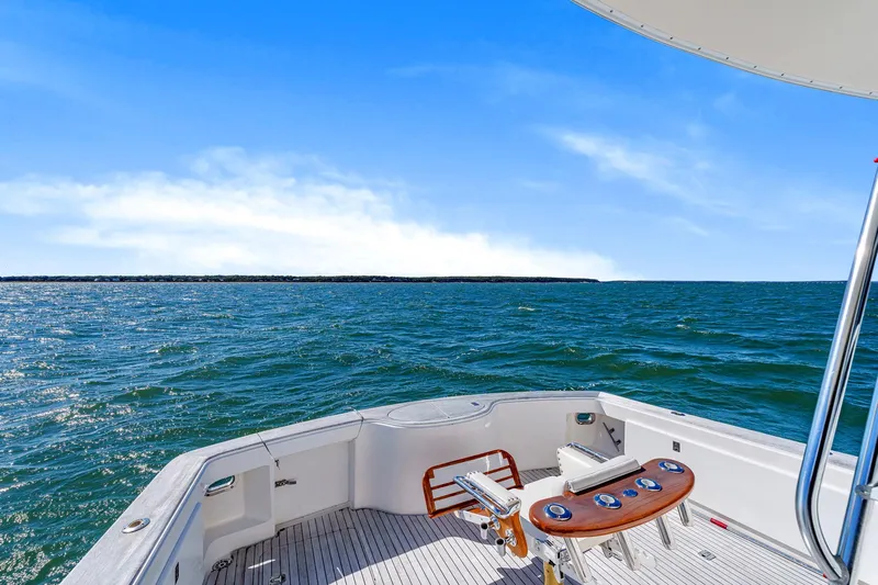 Sadie Ann II Yacht Photos Pics 2005 Ocean Yachts 50 Super Sport on open sea, clear blue sky, fishing chair visible.