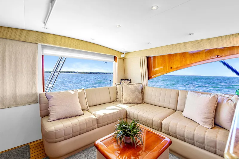 Sadie Ann II Yacht Photos Pics Luxurious interior of 2005 Ocean Yachts 50 Super Sport with ocean view and plush seating.
