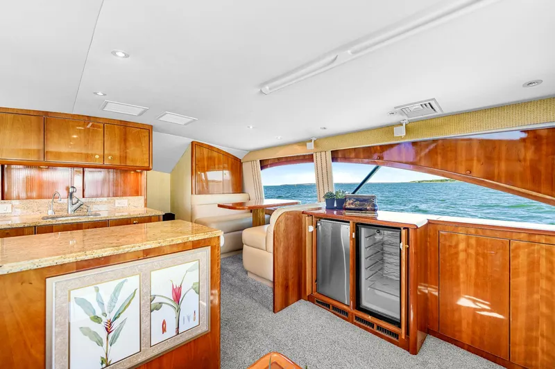 Sadie Ann II Yacht Photos Pics Luxurious interior of 2005 Ocean Yachts 50 Super Sport with elegant wood finishes and ocean view.