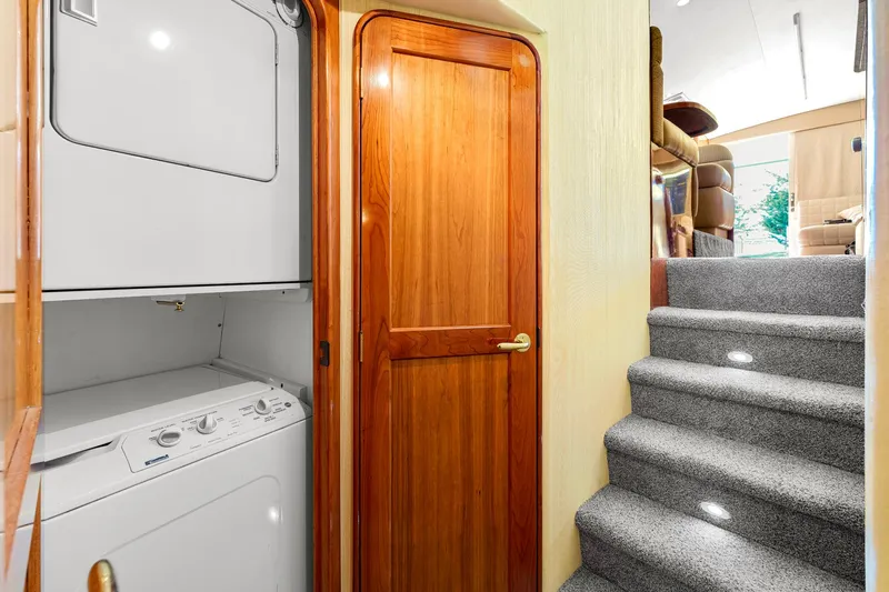Sadie Ann II Yacht Photos Pics Laundry area and carpeted stairs inside 2005 Ocean Yachts 50 Super Sport.