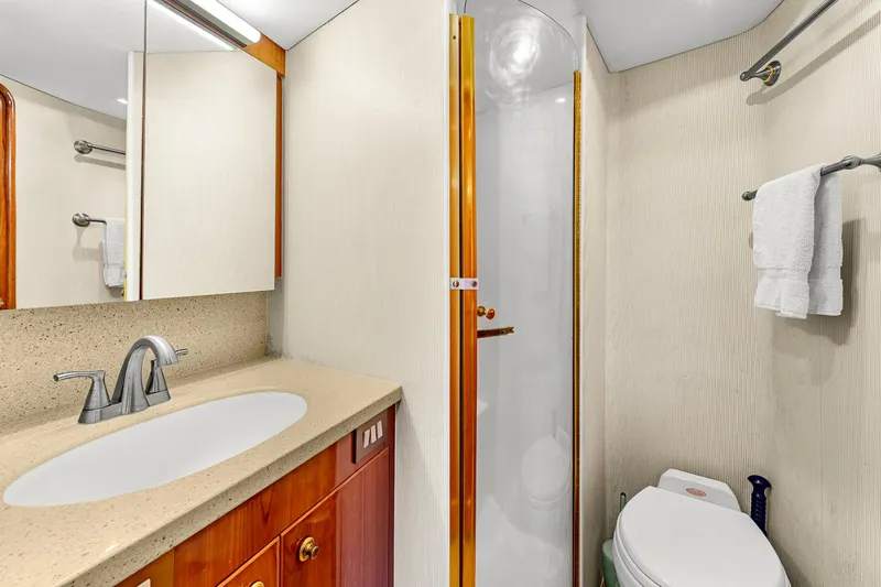 Sadie Ann II Yacht Photos Pics Luxurious bathroom in 2005 Ocean Yachts 50 Super Sport, featuring modern fixtures and elegant design.