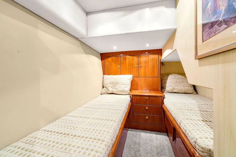 Sadie Ann II Yacht Photos Pics 2005 Ocean Yachts 50 Super Sport cabin with twin beds and wooden cabinetry.