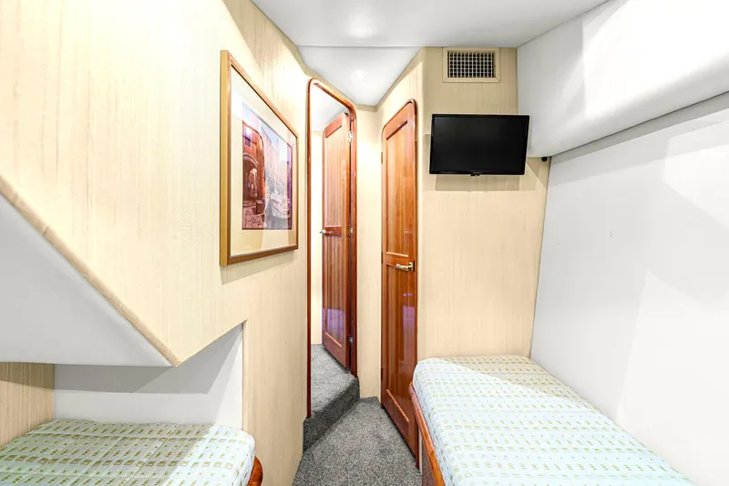 Sadie Ann II Yacht Photos Pics Interior cabin of 2005 Ocean Yachts 50 Super Sport with twin beds and TV.