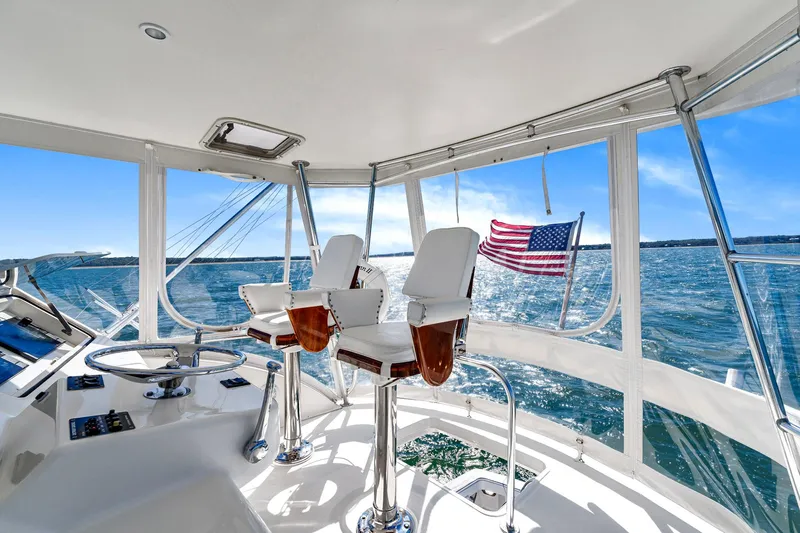 Sadie Ann II Yacht Photos Pics Interior view of 2005 Ocean Yachts 50 Super Sport with ocean backdrop and American flag.