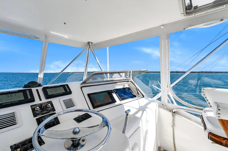 Sadie Ann II Yacht Photos Pics 2005 Ocean Yachts 50 Super Sport helm with ocean view and navigational instruments.