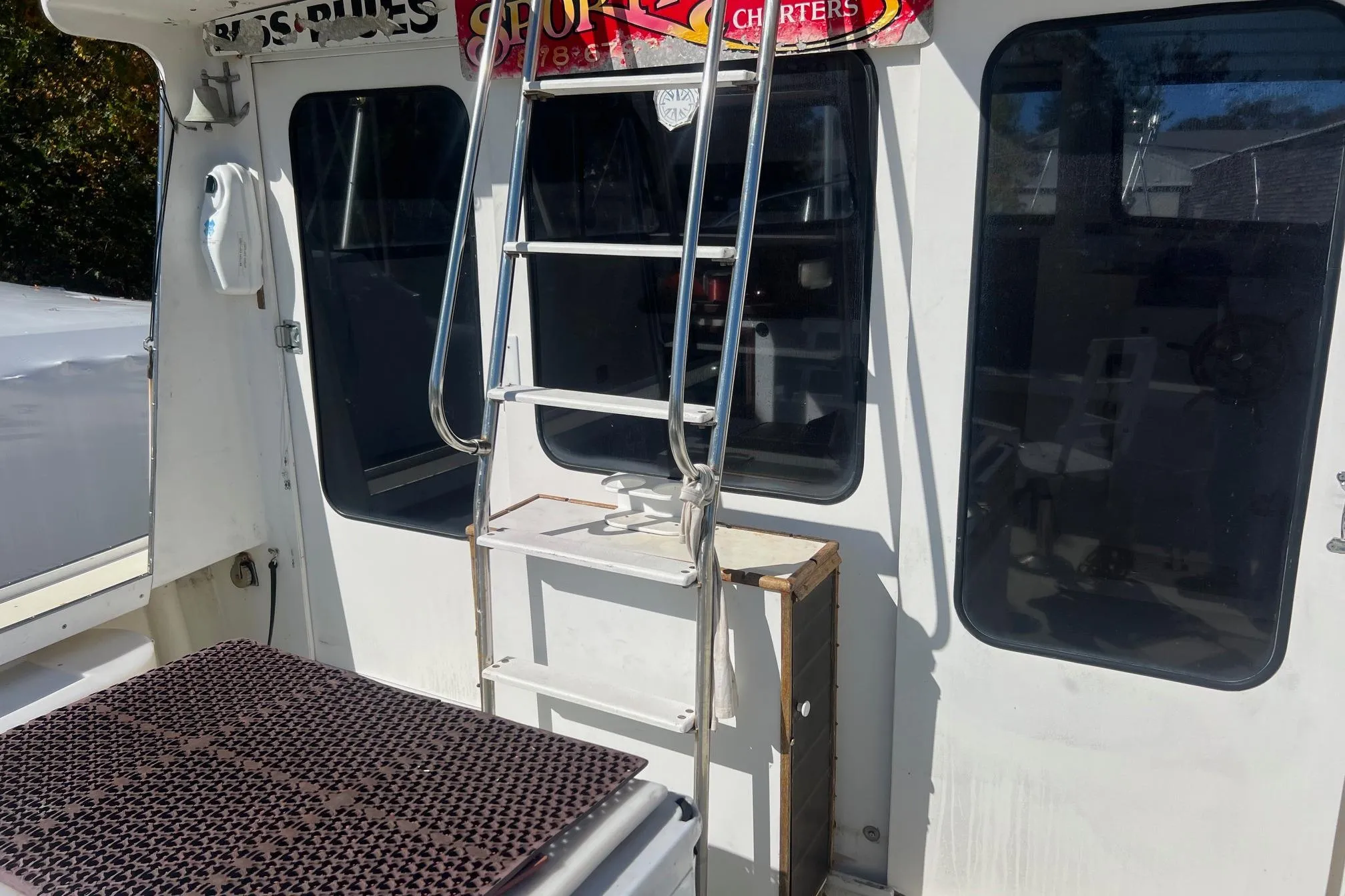 1995 Young Brothers 38 Fly Bridge boat with ladder and windows.