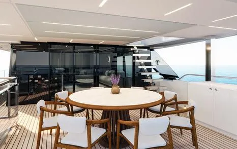 Build To Order Yacht Photos Pics Luxurious Majesty 112 Terrace yacht deck with elegant dining area, modern design, and ocean view.
