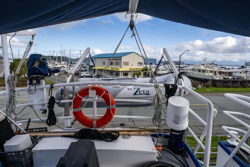 Zeta Yacht Photos Pics 2009 Diesel Duck 41-Plus boat with lifebuoy and equipment, docked near marina.