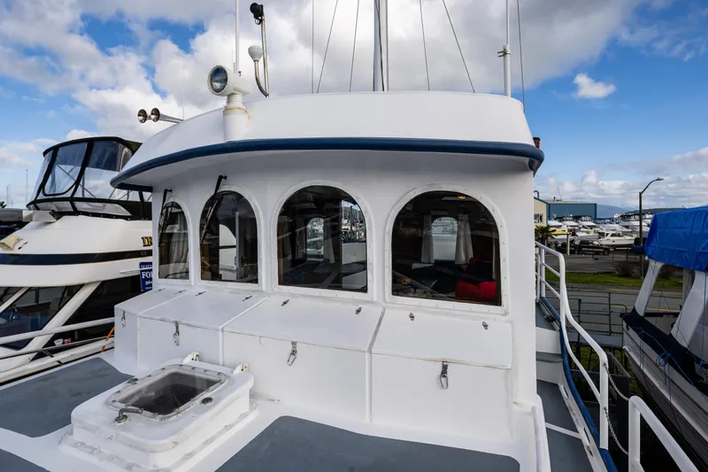Zeta Yacht Photos Pics 2009 Diesel Duck 41-Plus boat with white exterior and arched windows, docked at marina.