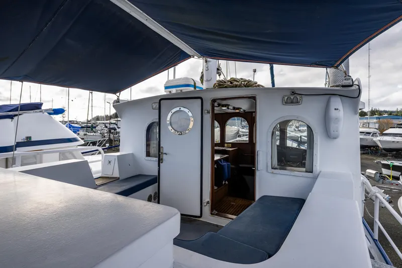 Zeta Yacht Photos Pics 2009 Diesel Duck 41-Plus yacht interior with seating and open cabin door.