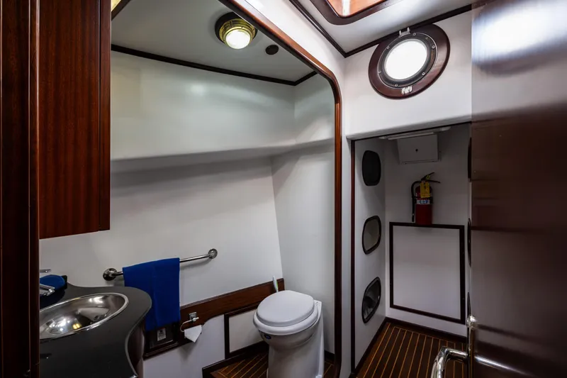 Zeta Yacht Photos Pics Luxurious 2009 Diesel Duck 41-Plus yacht bathroom with modern fixtures and wooden accents.