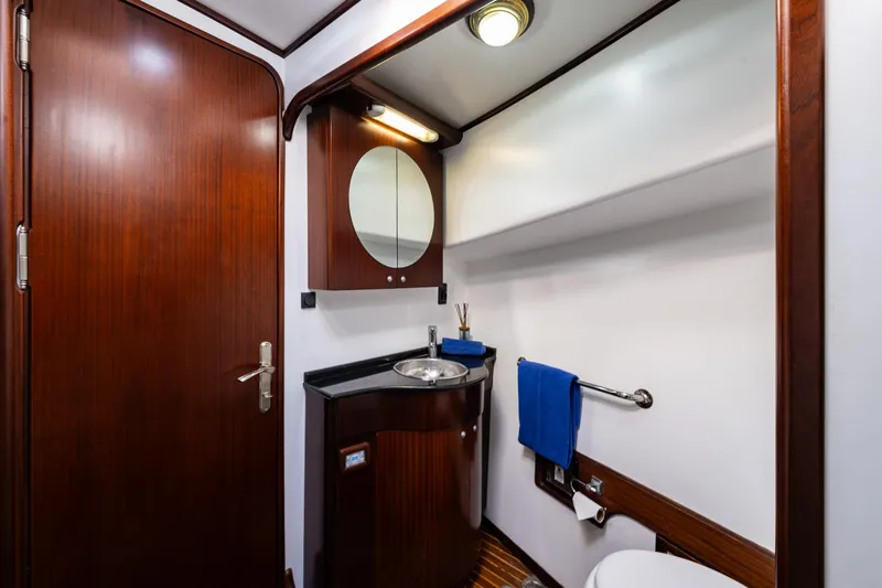 Zeta Yacht Photos Pics Luxurious 2009 Diesel Duck 41-Plus yacht bathroom with wood accents and modern fixtures.