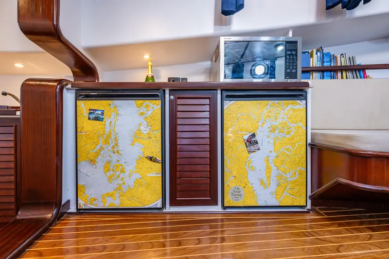 Zeta Yacht Photos Pics Interior of 2009 Diesel Duck 41-Plus yacht with nautical chart-themed cabinets.