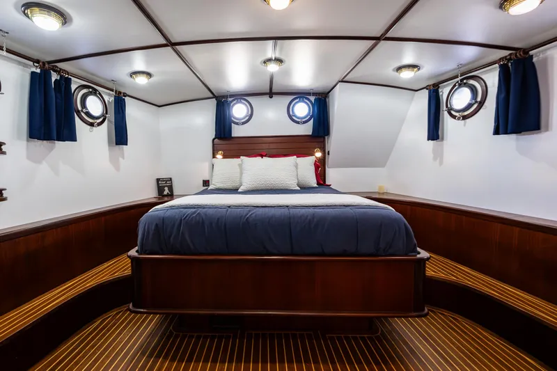 Zeta Yacht Photos Pics Luxurious cabin interior of 2009 Diesel Duck 41-Plus yacht with elegant wood finish.