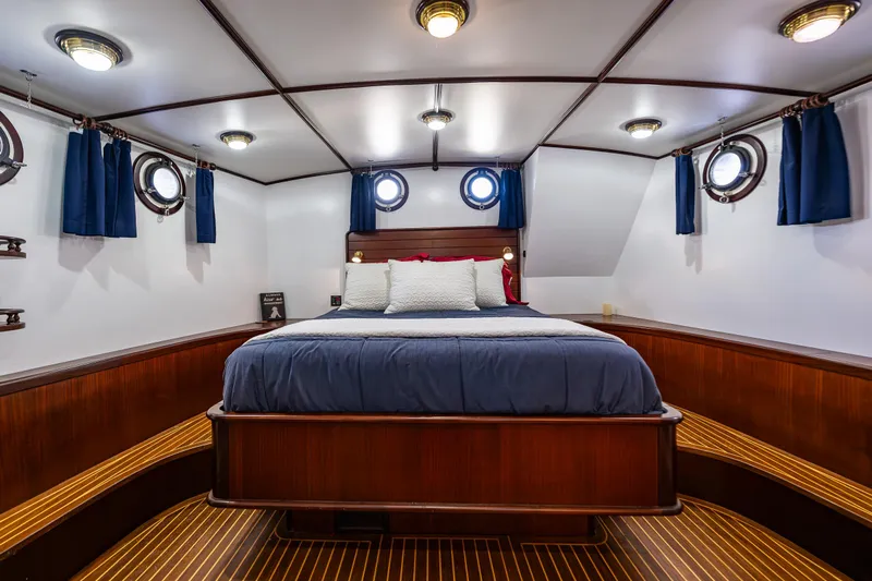 Zeta Yacht Photos Pics Luxurious cabin interior of 2009 Diesel Duck 41-Plus yacht with elegant wood finish.