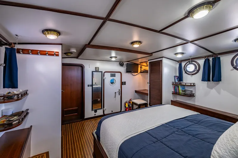 Zeta Yacht Photos Pics Luxurious 2009 Diesel Duck 41-Plus yacht cabin with elegant wood accents and nautical decor.