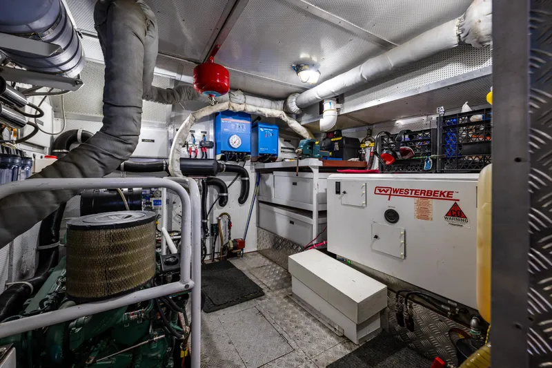 Zeta Yacht Photos Pics Engine room of 2009 Diesel Duck 41-Plus with Westerbeke generator and various equipment.