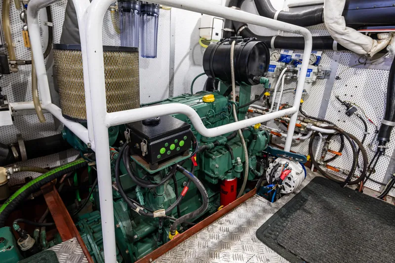 Zeta Yacht Photos Pics Engine room of a 2009 Diesel Duck 41-Plus boat, featuring complex machinery and piping.