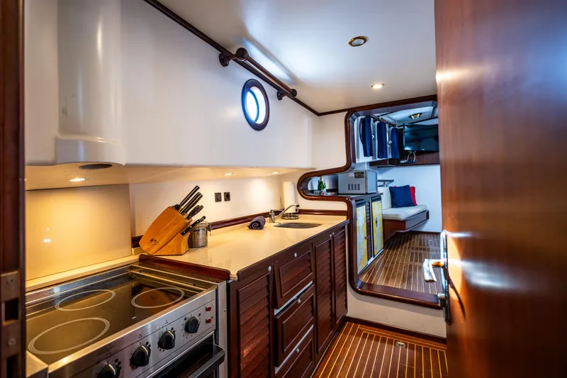 Zeta Yacht Photos Pics Interior of 2009 Diesel Duck 41-Plus yacht, featuring a modern kitchen and cozy living area.