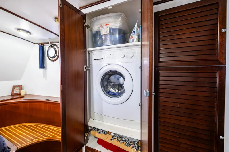Zeta Yacht Photos Pics Laundry area with washing machine in 2009 Diesel Duck 41-Plus yacht interior.