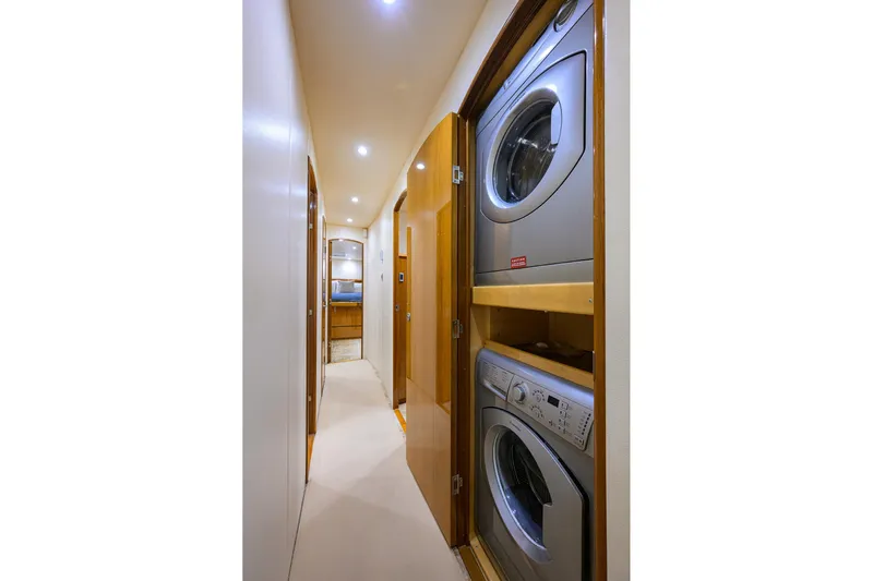 Osh-it Yacht Photos Pics Laundry area in 2014 Viking 76 Enclosed Bridge Convertible yacht hallway.