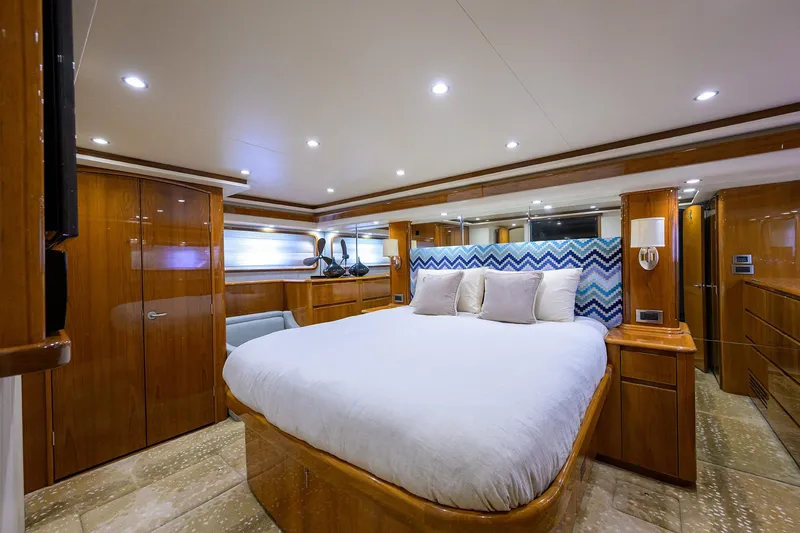 Osh-it Yacht Photos Pics Luxurious bedroom interior of 2014 Viking 76 Enclosed Bridge Convertible yacht.