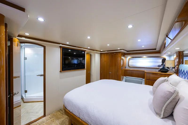 Osh-it Yacht Photos Pics Luxurious bedroom interior of 2014 Viking 76 Enclosed Bridge Convertible yacht.