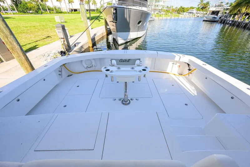 Osh-it Yacht Photos Pics 2014 Viking 76 Enclosed Bridge Convertible yacht deck, featuring spacious fishing area.