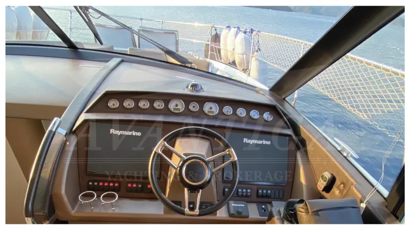  Yacht Photos Pics Helm of 2016 Prestige 620 yacht with Raymarine navigation system, overlooking the sea.