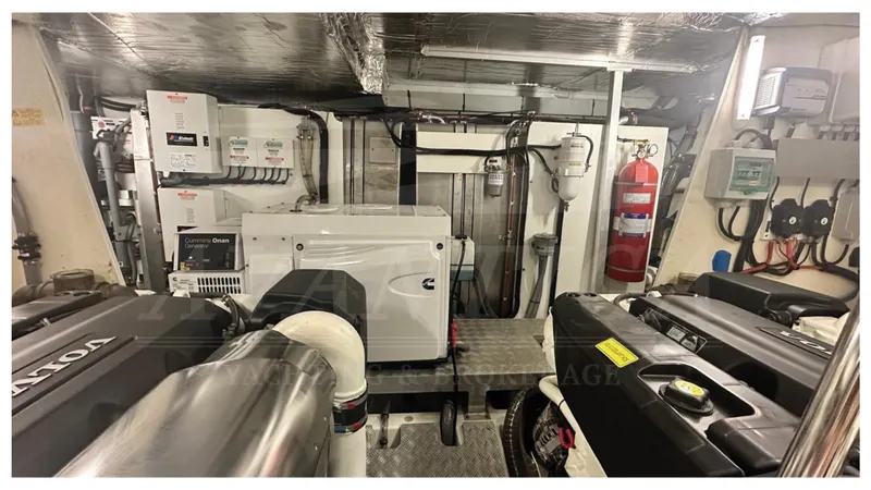  Yacht Photos Pics Engine room of a 2016 Prestige 620 yacht, featuring modern equipment and fire safety gear.